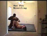 Larry L enjoys punishing his adversary with a devastating chinlock.