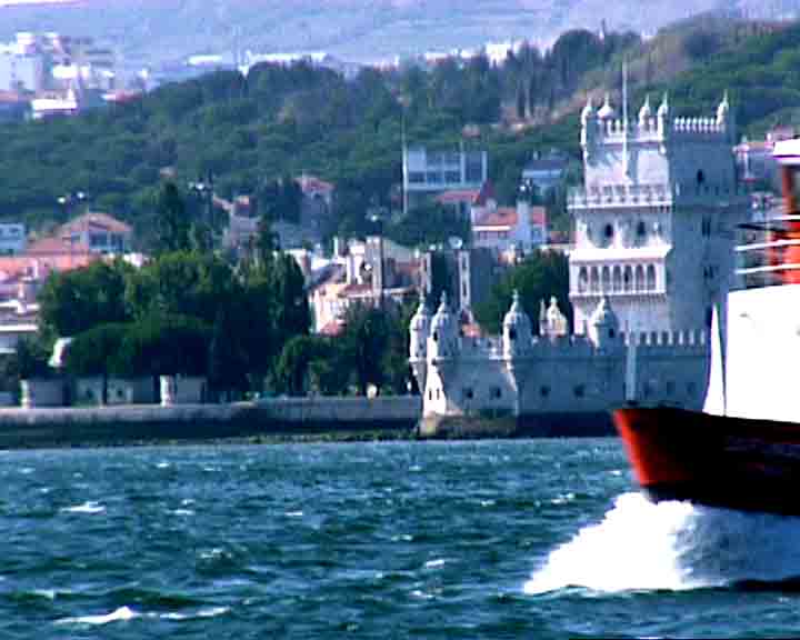 Lisbon sightseeing tours - a ferry boat having Belem tower as a background.