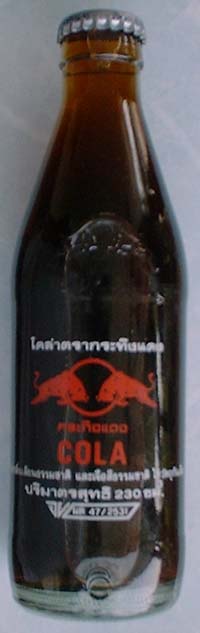 5. 230ml Red Bull Cola Bottle from Thailand. Height of bottle is 7.20 inches and diameter at the base is 2 inches. The wordings are in Thai Language.