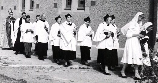 Bishop Winter follows the Choir to lay The Foundation Stone for the new Hall
