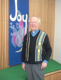 John at lectern