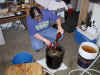 Pam adding the secret sauce.jpg (74433 bytes)