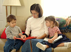 Elisa reading to Louis and Becky