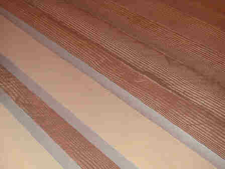 woodgrain floor with masking tape