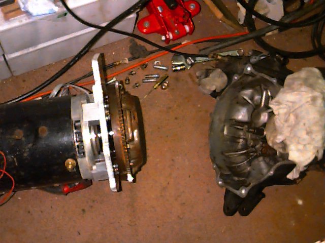 Motor with flywheel and adapter bolted together