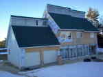 Siding on southwest, porch windows installed