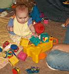20050205_07b-Emily6 mo_knockingoverDaddyMatts_blocks.jpg