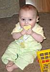 20050223_10w-EmilyHiggins-7mo_chewingonCowbib.jpg