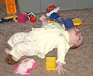 20050313_19w-EmilyGraceHiggins-8mo_ScootchingacrosstheFlooronherBack.jpg