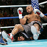 Roy falls to the canvas