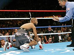 Roy climbs to his feet and more than certainly could have finished the fight if Gay Nady weren't such a terrible ref