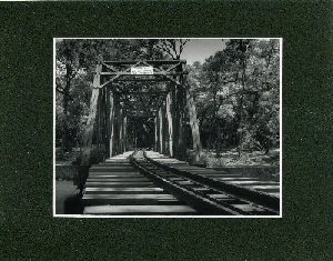 picture of train tracks on bridge