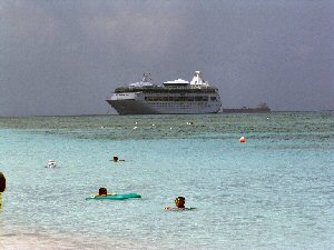 color corrected picture of swimmers with ship in background