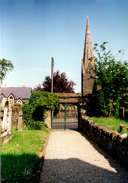 Ballymoney graveyard with Parish Church in background - McFarland gravestone first at entrance
