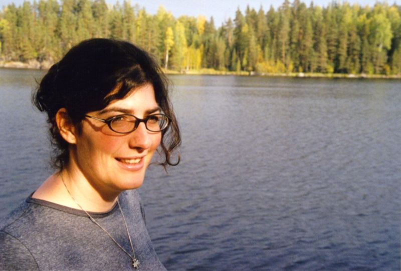Elke by the lake at Pasi's summer place.