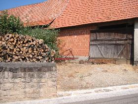 Wood heap and farm equipment