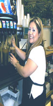 Here is Danielle, one Virginia 3 daughters, getting soda for the guests. Always smiling 8^). 