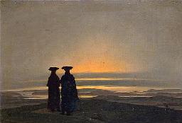 Two men talking on the beach