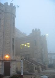 The Gothic castle-like structure of Saint Olaf College, on a slighty foggy day for mysterious mood effect.