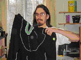 Sean receiving his first cloak from Matt.  Cloaks are widely worn at Carleton, especially in Fall/Winter, by both the Carleton Druids and the Society of Creative Anachronists (SCA) who love medieval clothing.  In the frigid weather, an extra cloak layer keep you warm and your backpack dry.
