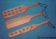 these paddles, apparently were either derived from butter churning paddles used for corporeal punishment in farming communities, or from angry canoists.