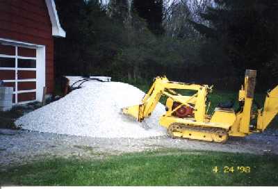 Magnatrac 4000 handling gravel pile