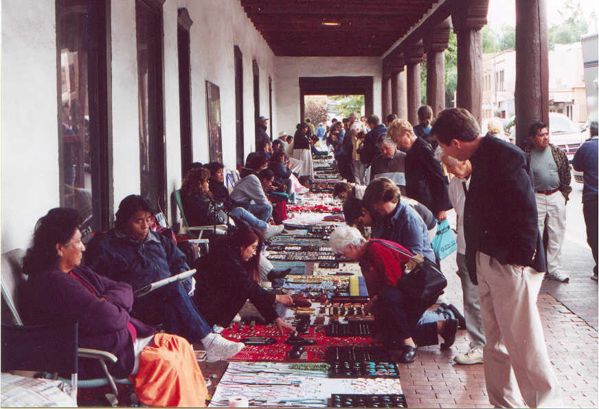 Native Americans selling jewelry in front of Palace of Governors.