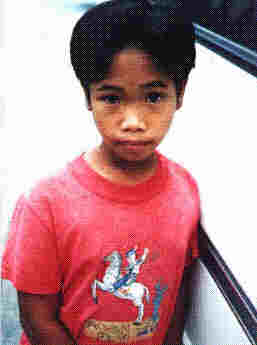 Beggar Boy, photo by Mila D. Aguilar