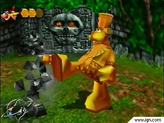 A big golden bear kicking down a stone wall
