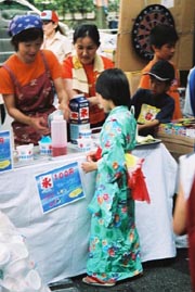 A Little Girl In Yukata Getting A Snow Cone
