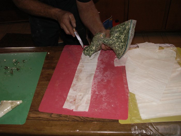 place a blob of filling at end of strip using a pastry bag or spoon