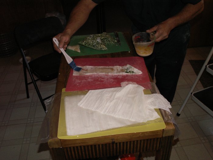 carefully brush butter down strip