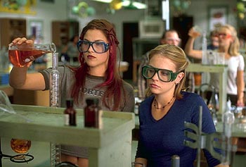 Ali Larter (Varsity Blues) and Joan Hart in one of the film's better scenes (though anyone who measures chemicals like these two do is going to get an F in any Chem class)