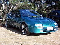 Dogo's V6 Machine... sports 18" wheels, pedders springs and interior gadgetry extravaganza , LCD TV screen - DVD player - PS2 and so much more!!