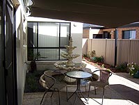 The courtyard boasts fountain and black weather sail..... [the black thing at the top of the pic]