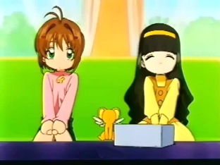 Sakura, Kero-chan y Tomoyo mirando el resultado