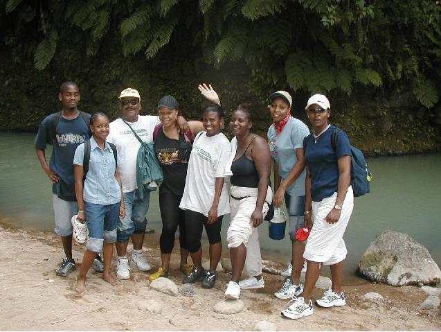 Staff and friends posing by the White River on the way to Victoria Falls