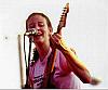 Danielle playing a free show during a bicycle race in Columbia while enduring blistering heat