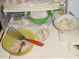 Soon-to-be-meatballs in a bowl, and Jansson's Temptation on a small and a larger plate