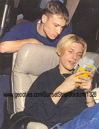 either brian is trying to smell Nick's hair, or he's just trying to see what Nick's doing
