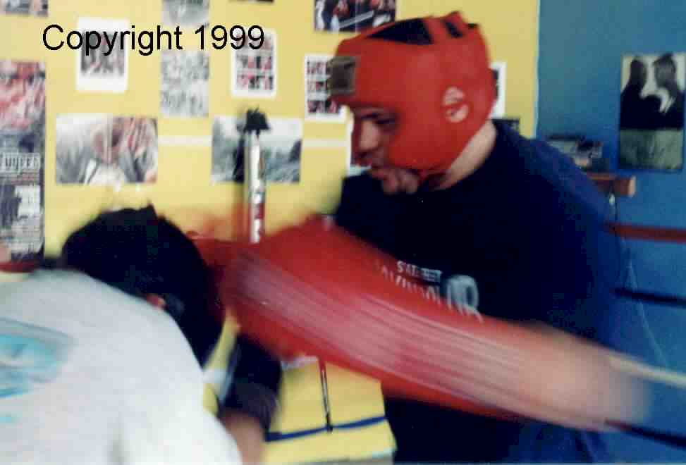 Coach working with boxer in preparation for competition.  Copyright 1999.  All rights reserved.