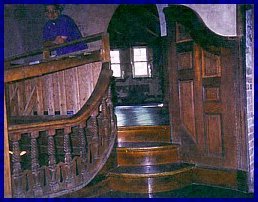 Curved stairs, oak paneling and carved baluster in Alster Tower