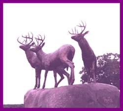 Another view of theThree Harts sculptor atop the Arch of Honor