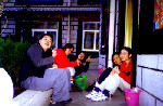 Sitting at the courtyard outside our dorms eating apples