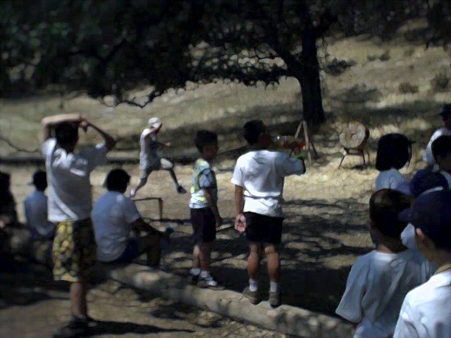 Webelos and Bears completing the obstacle course