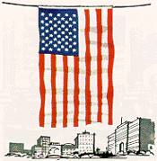 Image of USA flag displayed over the middle of the street.