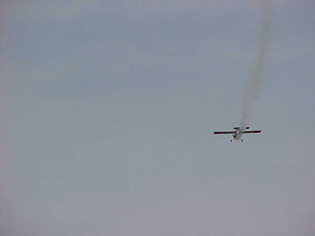 The Giant Stinger on a downwind pass with smoke on.