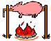 Pig cooking on spit