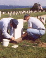 Repairing a headstone at Fort Adams Cemetery