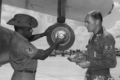 Jim Green (rt) from North Dakota in an October 1966 photo at Korat. MSgt McPherson his NCOIC on the left.
